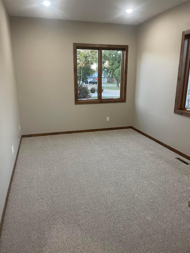 unfurnished room with carpet floors