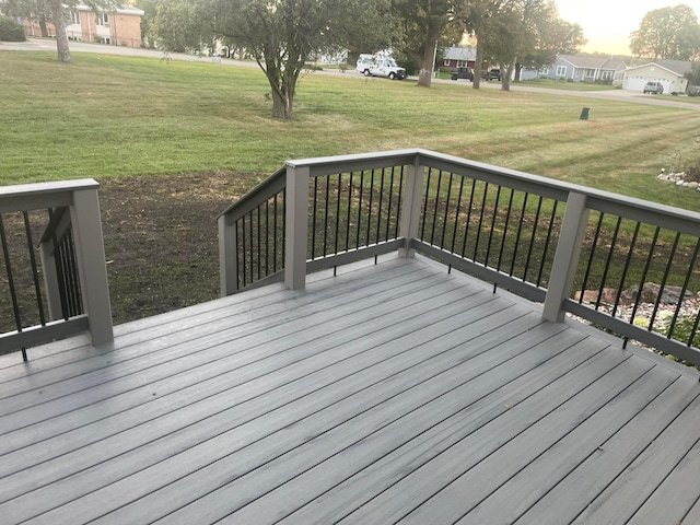 wooden deck featuring a yard