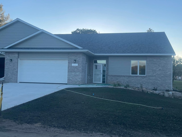 single story home with a garage