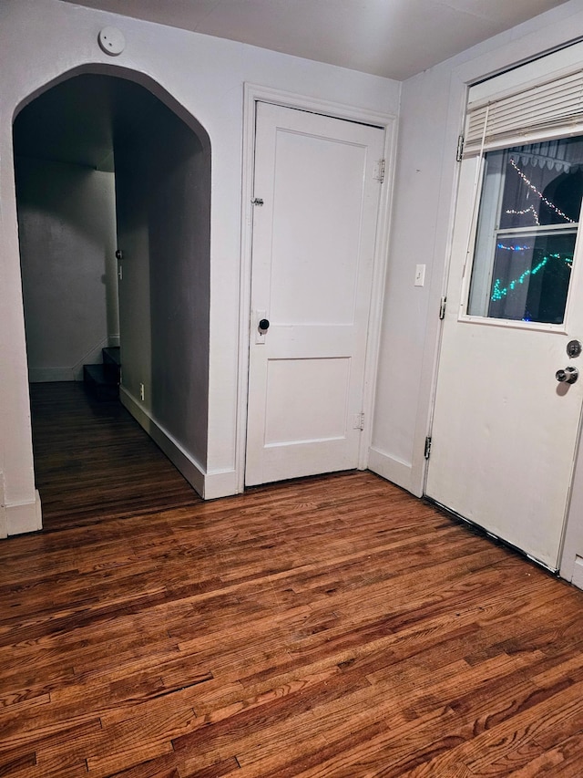 interior space with dark hardwood / wood-style floors