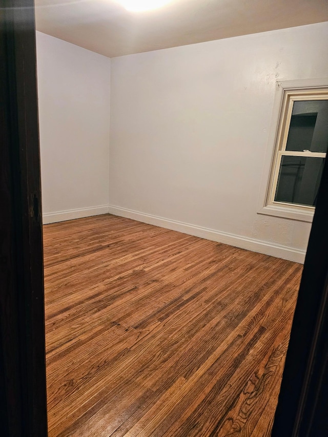 spare room featuring hardwood / wood-style floors