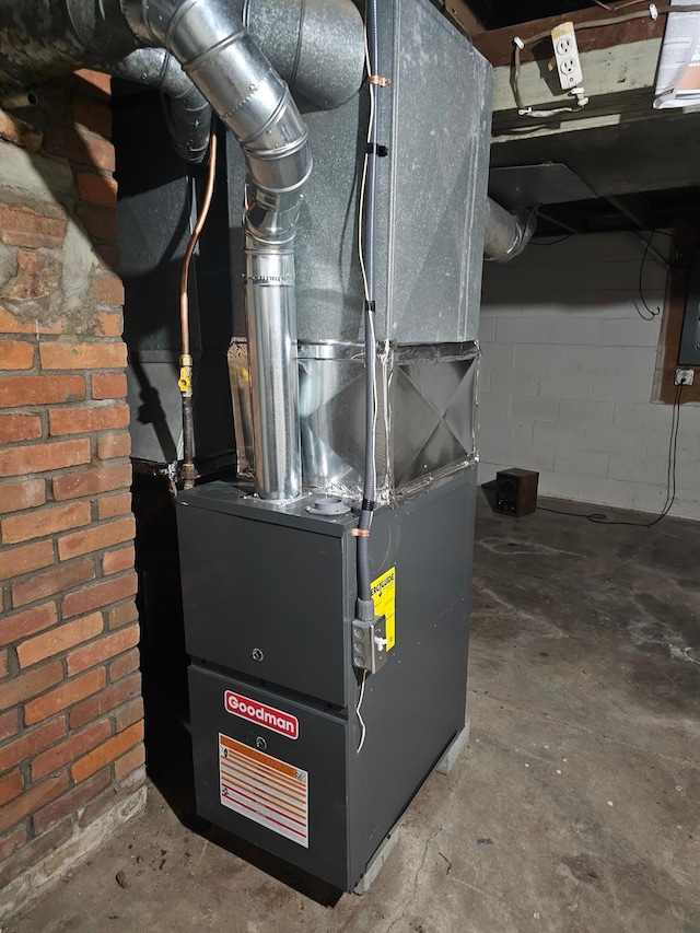 utility room featuring heating unit