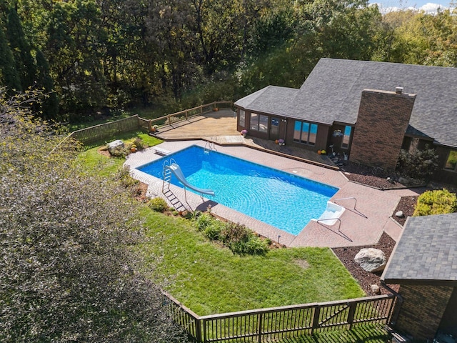 6517 Crackleberry Trl, Woodbury, MN 55129 - view of swimming pool featuring a wooden deck, a fenced backyard, and a water slide