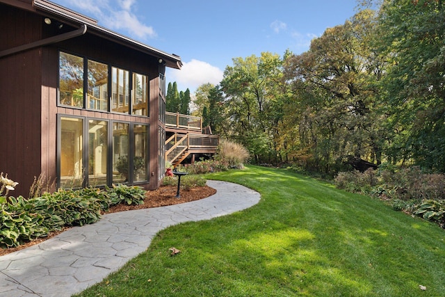 6517 Crackleberry Trl, Woodbury, MN 55129 - view of grassy yard with a deck and stairs