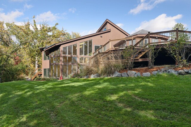 6517 Crackleberry Trl, Woodbury, MN 55129 - rear view of property with stairs, a wooden deck, and a lawn