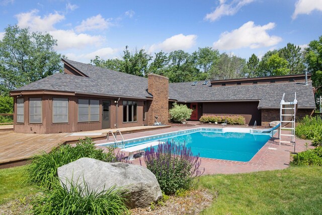 6517 Crackleberry Trl, Woodbury, MN 55129 - swimming pool with a water slide, a deck, and a diving board