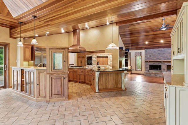 6517 Crackleberry Trl, Woodbury, MN 55129 - kitchen featuring built in fridge, open floor plan, ceiling fan, range hood, and wooden ceiling