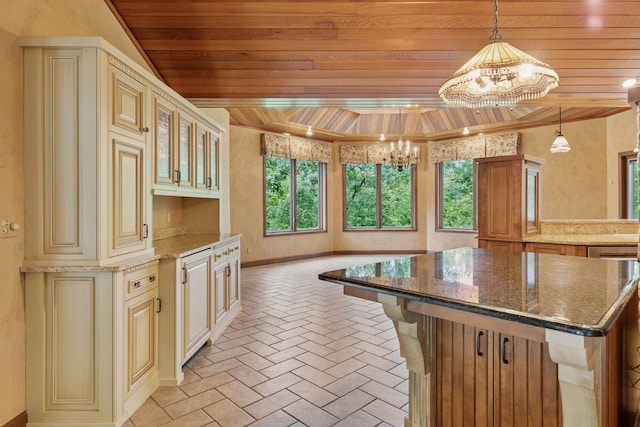 6517 Crackleberry Trl, Woodbury, MN 55129 - kitchen featuring a chandelier, wooden ceiling, cream cabinets, brick floors, and dark stone countertops