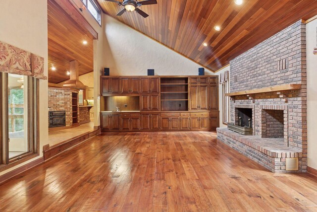 6517 Crackleberry Trl, Woodbury, MN 55129 - unfurnished living room featuring a fireplace, high vaulted ceiling, light wood-type flooring, wooden ceiling, and a ceiling fan
