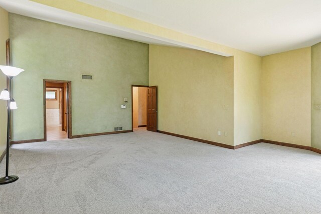6517 Crackleberry Trl, Woodbury, MN 55129 - carpeted empty room with baseboards and a high ceiling
