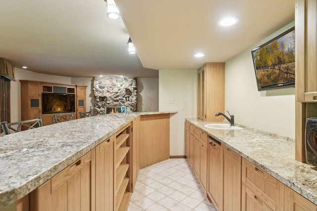 6517 Crackleberry Trl, Woodbury, MN 55129 - kitchen featuring light tile patterned floors, a stone fireplace, light stone countertops, open shelves, and light brown cabinetry
