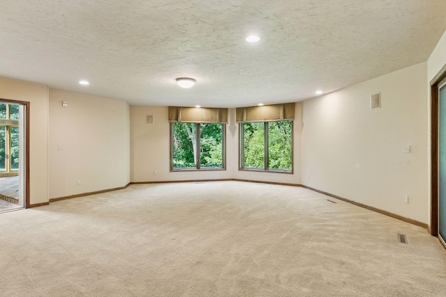 6517 Crackleberry Trl, Woodbury, MN 55129 - empty room with light carpet, recessed lighting, and a textured ceiling