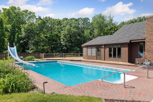 6517 Crackleberry Trl, Woodbury, MN 55129 - view of swimming pool with a water slide, a deck, and a patio area