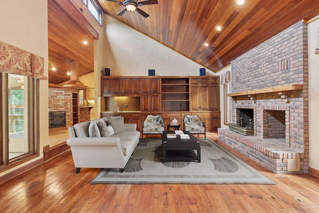 6517 Crackleberry Trl, Woodbury, MN 55129 - living area with a fireplace, high vaulted ceiling, wood ceiling, hardwood / wood-style flooring, and ceiling fan