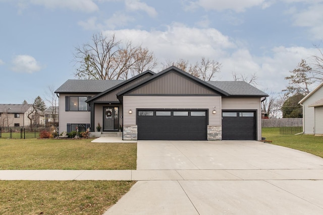 view of front of property featuring a garage and a front yard