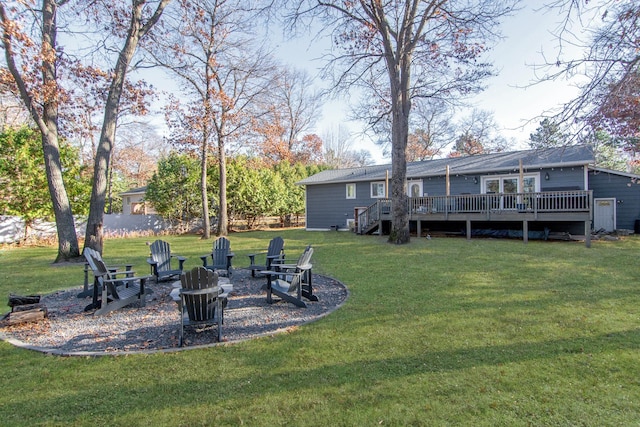 view of yard with a fire pit and a deck