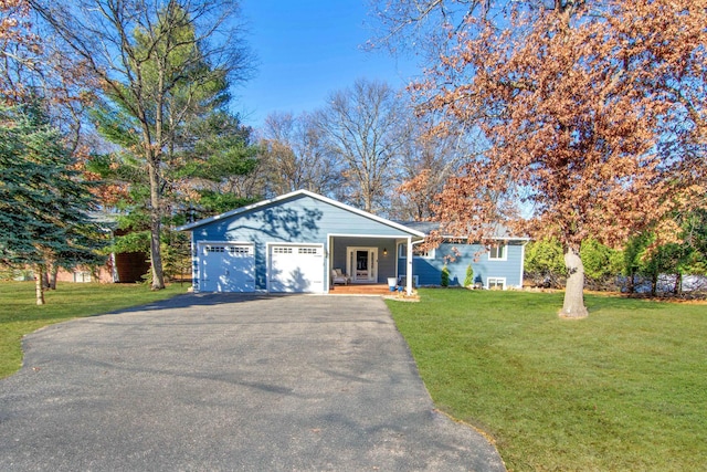 ranch-style house with driveway, an attached garage, a porch, and a front yard