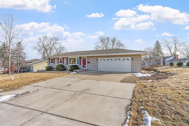 ranch-style house with an attached garage and driveway