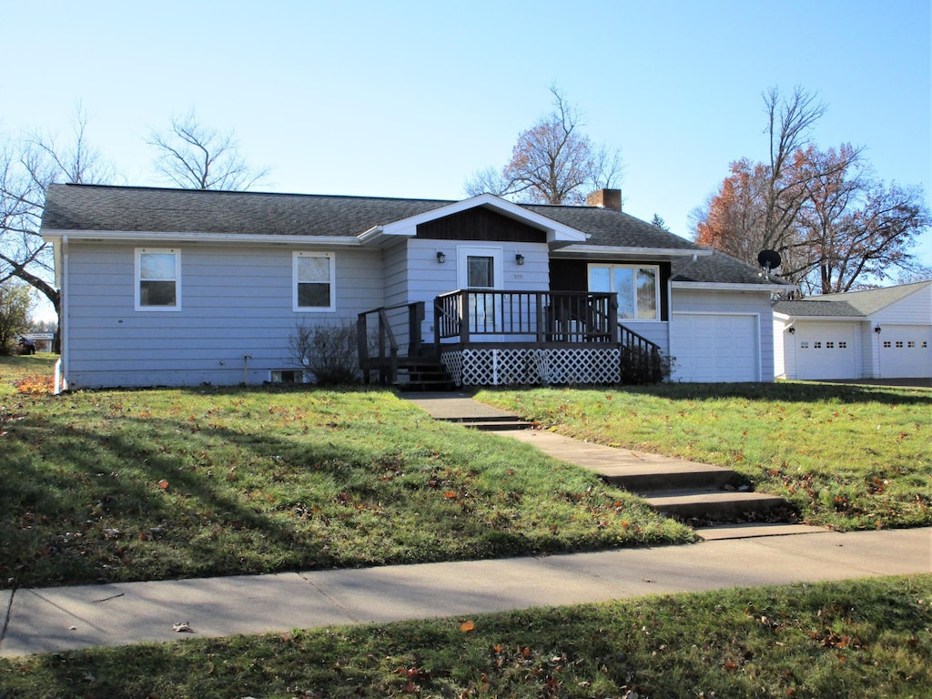 single story home with a front lawn and a garage