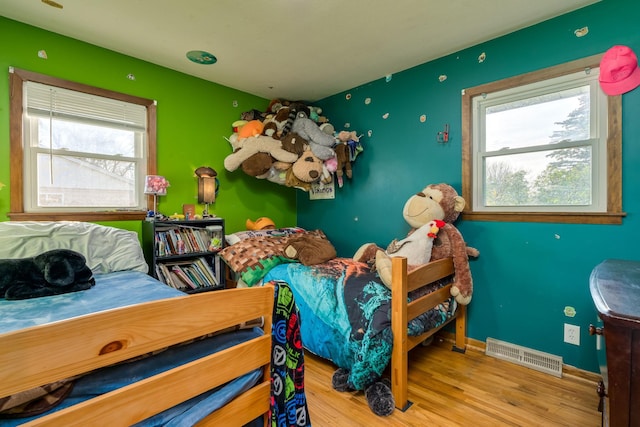 bedroom with light hardwood / wood-style floors