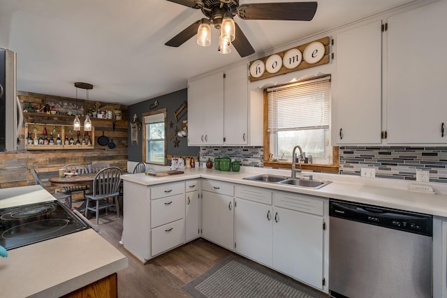 kitchen with sink, white cabinetry, hanging light fixtures, plenty of natural light, and stainless steel dishwasher