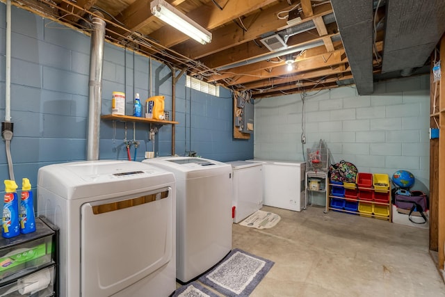 washroom featuring washing machine and dryer