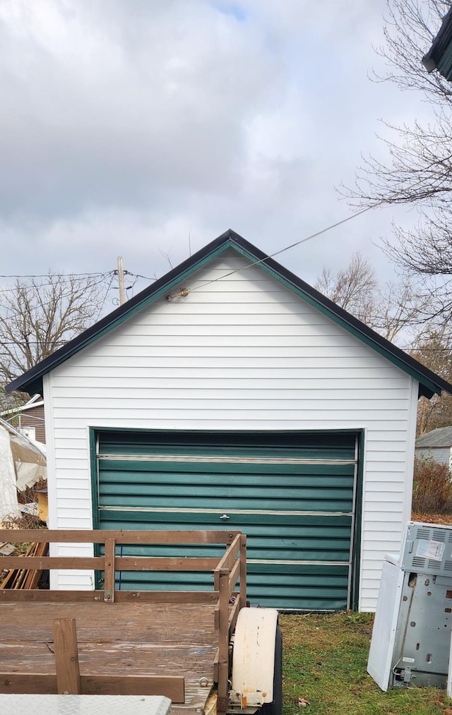 view of home's exterior with an outbuilding and a garage