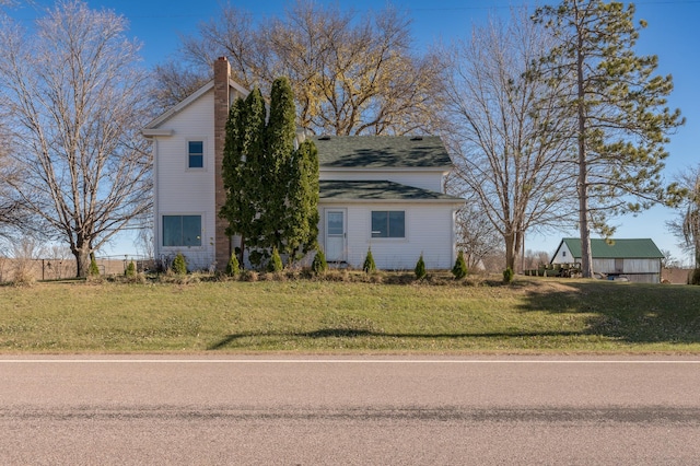 view of home's exterior with a lawn