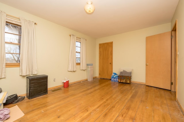 spare room featuring light hardwood / wood-style floors