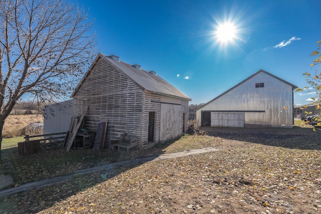 view of property exterior with an outdoor structure