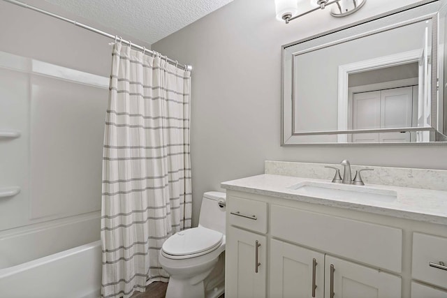 full bathroom with shower / bath combination with curtain, vanity, a textured ceiling, and toilet