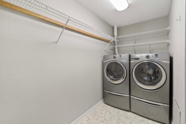 clothes washing area with independent washer and dryer