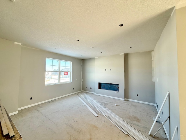 unfurnished living room with a textured ceiling