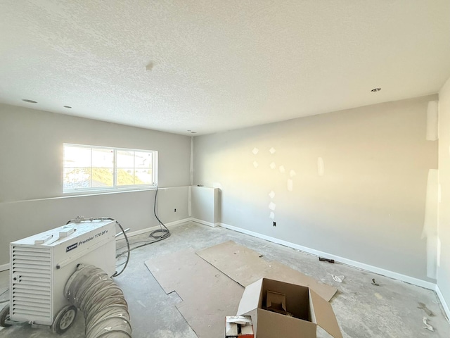 empty room with a textured ceiling