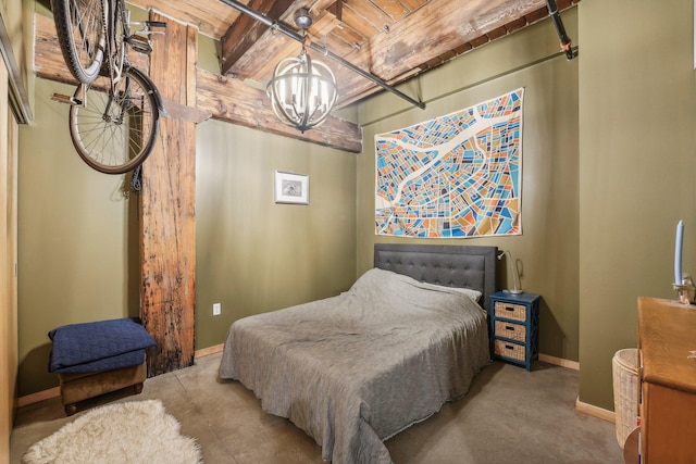 bedroom featuring a notable chandelier and wood ceiling