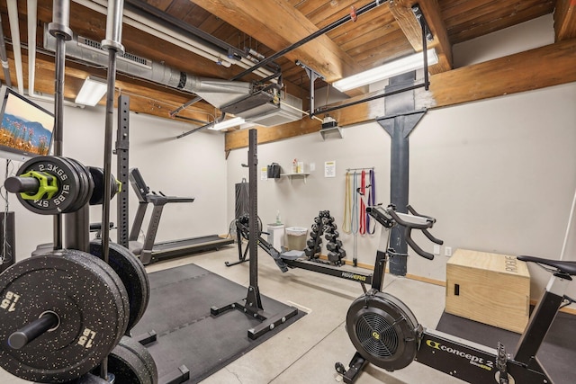 workout room featuring wood ceiling