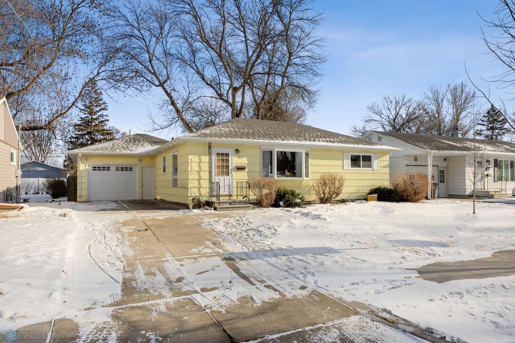 single story home with a garage