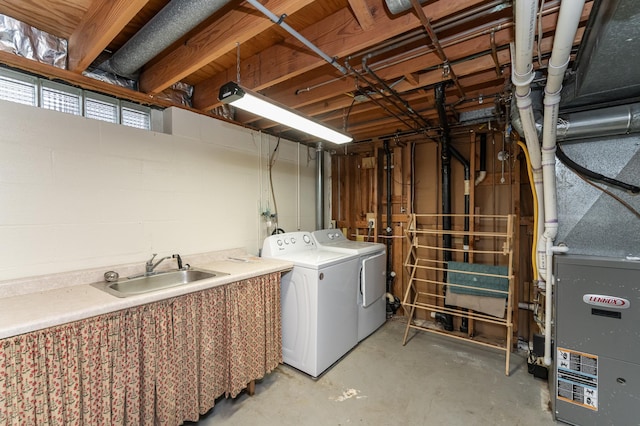 basement featuring sink and washing machine and clothes dryer