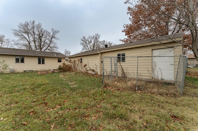 back of house featuring a yard