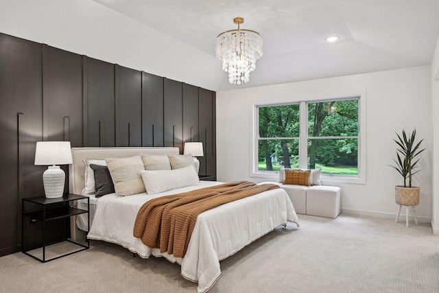 bedroom featuring light carpet, a chandelier, and vaulted ceiling