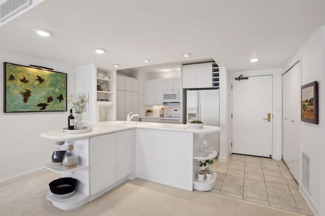 1920 1st St Unit 2001, Minneapolis, MN 55454 - kitchen featuring open shelves, white appliances, white cabinetry, light countertops, and modern cabinets