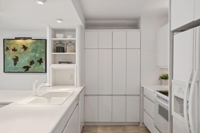 1920 1st St Unit 2001, Minneapolis, MN 55454 - kitchen with white appliances, open shelves, white cabinetry, light countertops, and modern cabinets