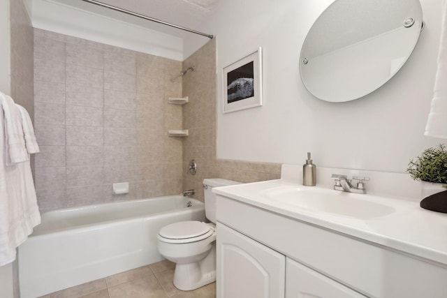 full bathroom featuring tile patterned floors, tiled shower / bath combo, toilet, and vanity