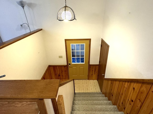 stairway with wood walls