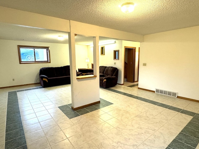 interior space with a textured ceiling