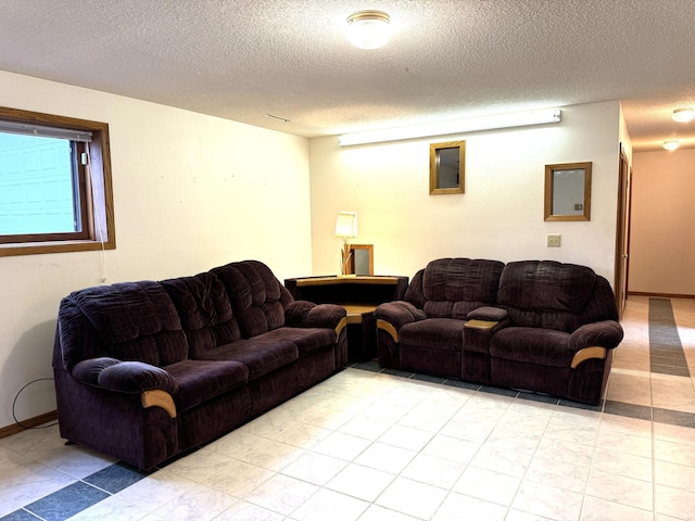 living room featuring a textured ceiling