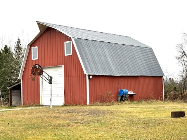 view of outbuilding with a yard