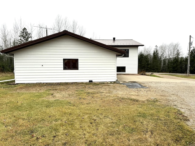 view of home's exterior featuring a lawn