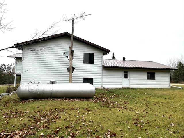 rear view of house with a lawn