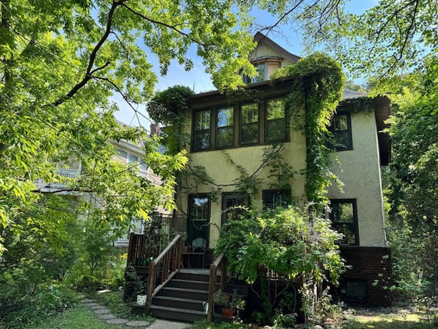 view of front of house featuring stucco siding